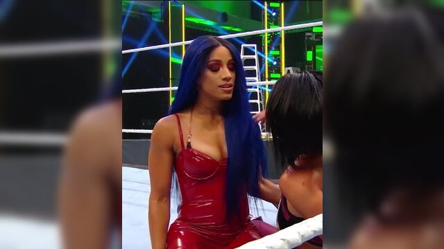 WWE - Sasha Banks in hot red outfit looking out for Bayley