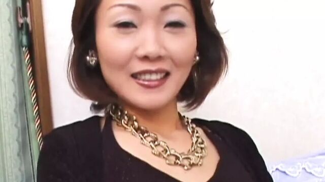 Solo Asian MILF enjoys masturbation